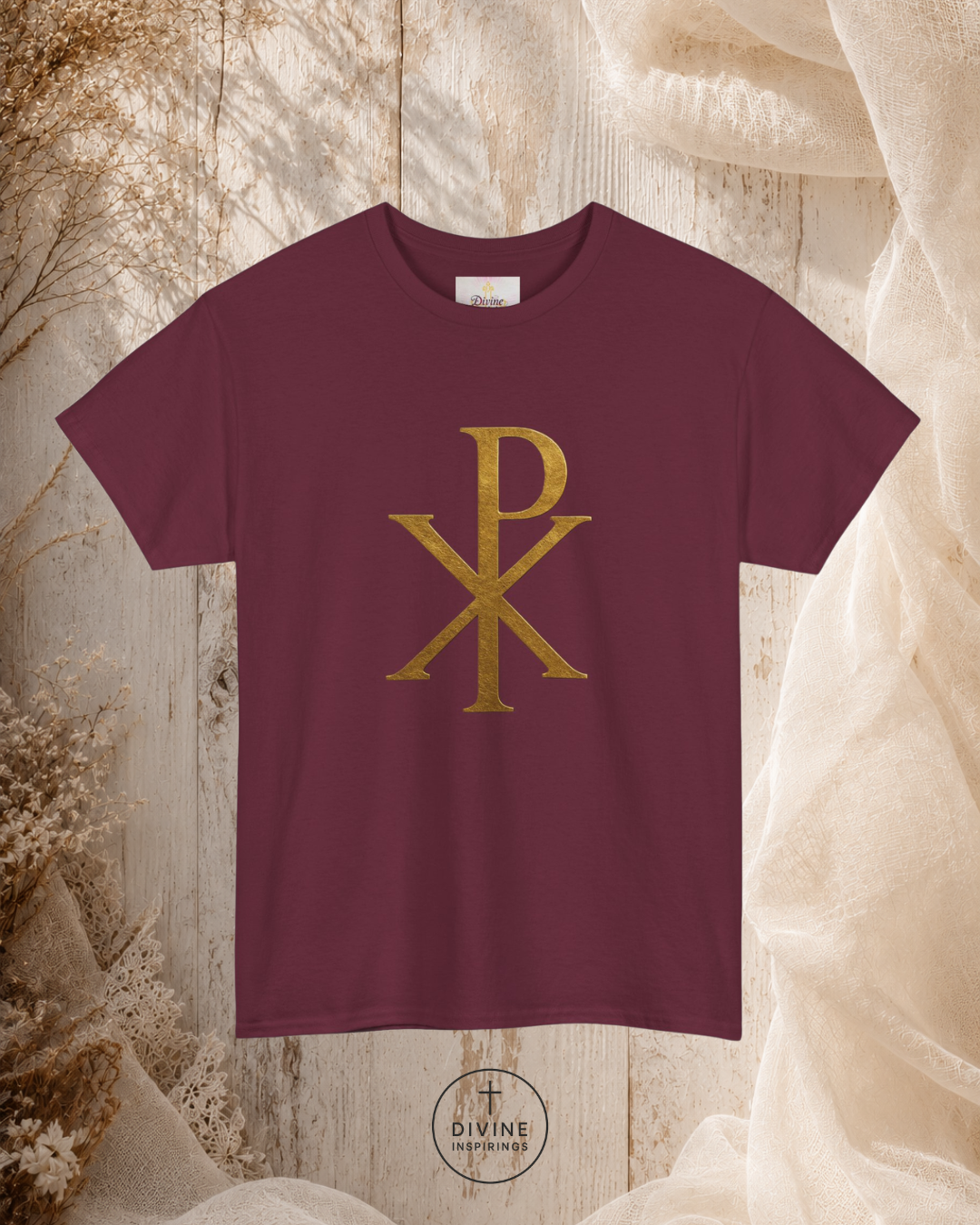 Maroon t-shirt with gold symbol on a textured beige background
