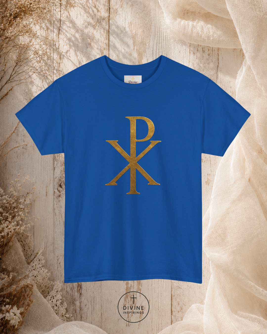 Blue t-shirt with gold symbol on a textured beige background