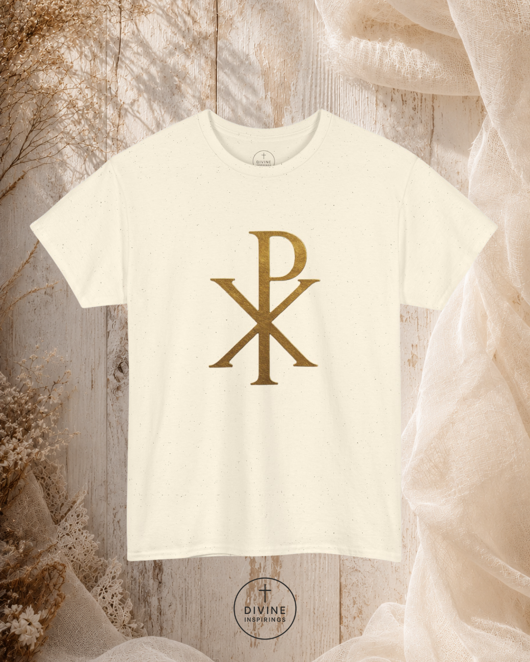 White t-shirt with gold symbol on a textured surface