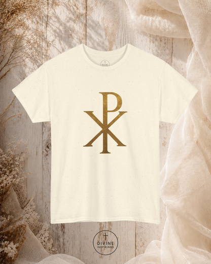 White t-shirt with gold symbol on a textured surface