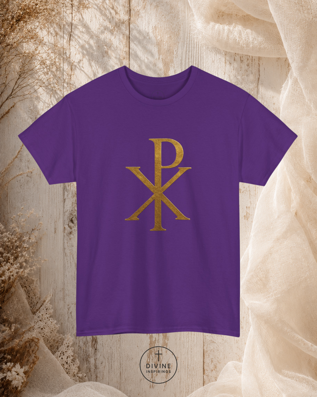 Purple t-shirt with gold symbol on a textured beige background