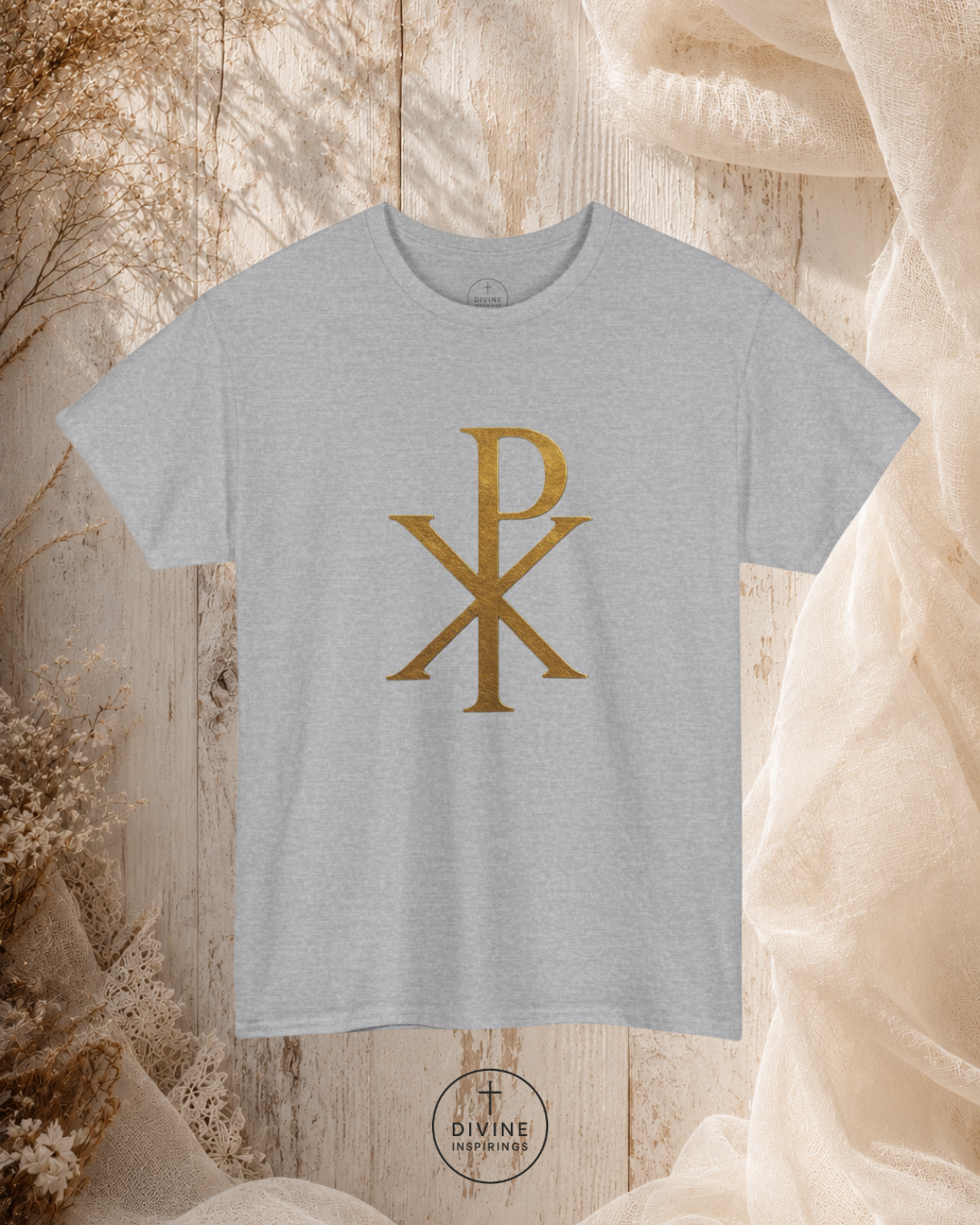 Gray t-shirt with gold symbol on a textured beige background