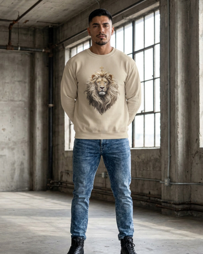 Man wearing a beige sweatshirt with a lion graphic in an industrial setting