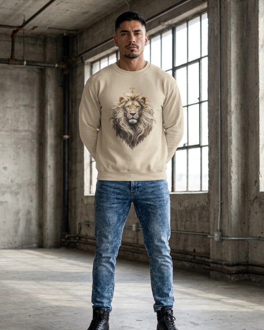 Man wearing a beige sweatshirt with a lion graphic in an industrial setting
