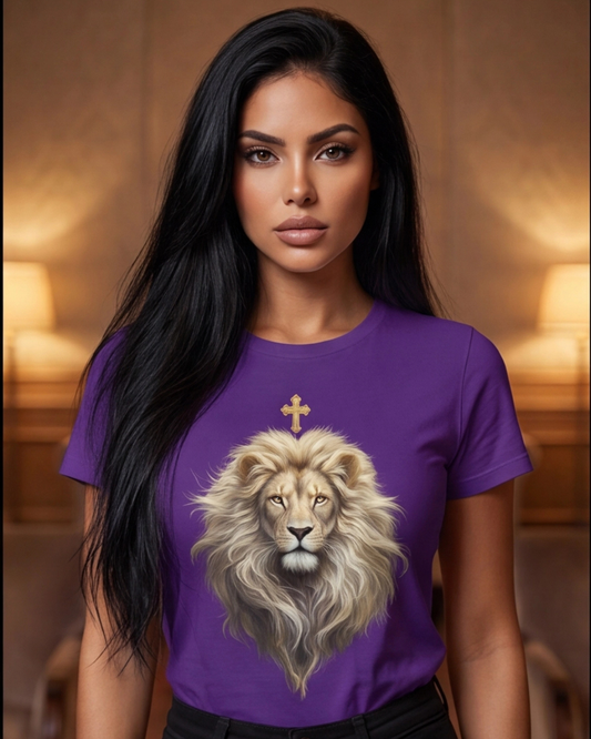 Woman wearing a purple t-shirt with a lion design and cross, set against a warm-toned background.