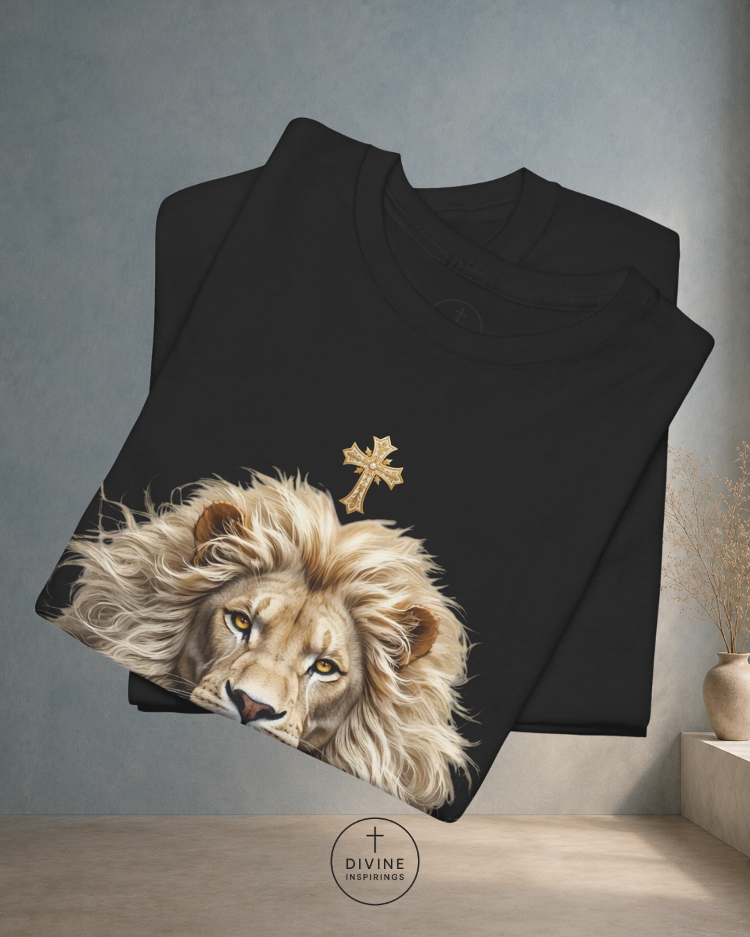 Black t-shirt with a lion and cross design on a gray background