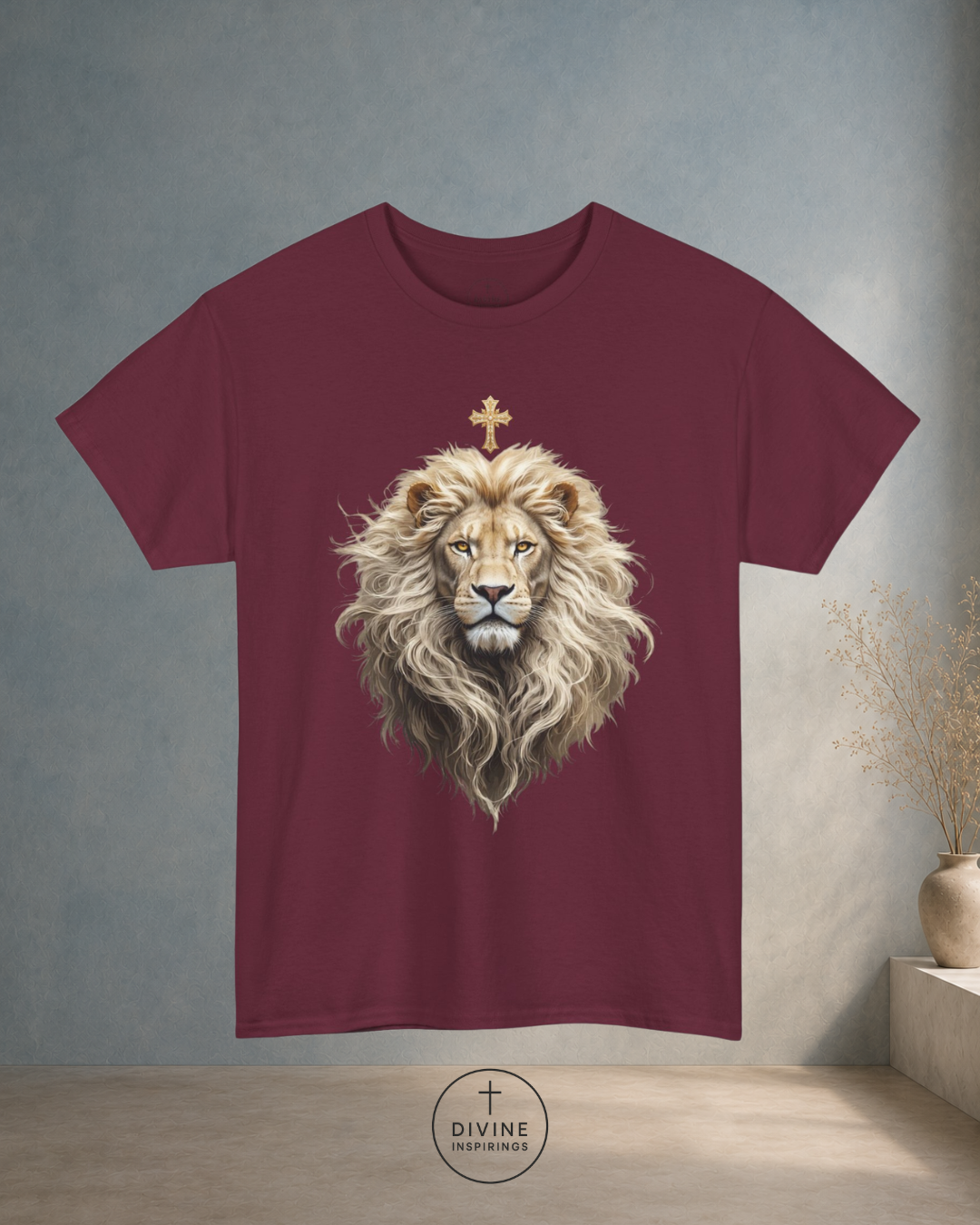Maroon t-shirt with a lion design on a neutral background