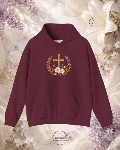 Maroon hoodie with floral and cross design on a floral background