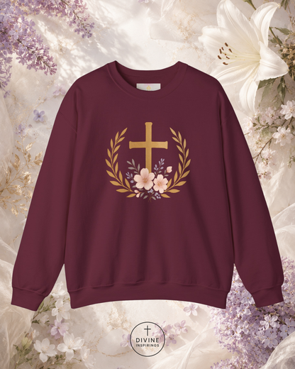 Black sweatshirt with a gold cross and floral wreath design on a floral background