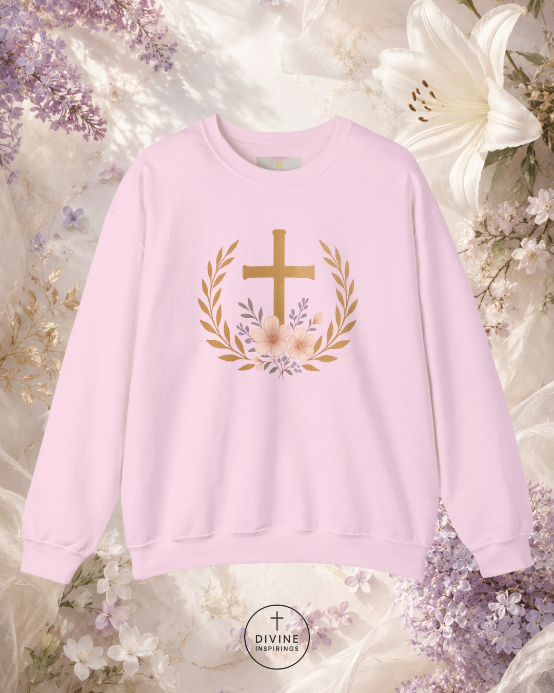 Pink sweatshirt with a gold cross and floral design on a floral background