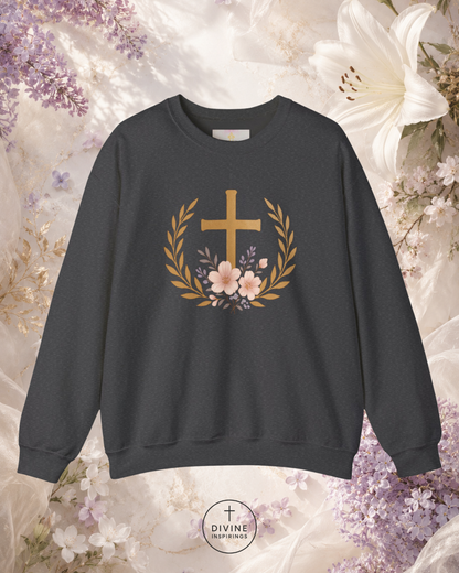 Black sweatshirt with a gold cross and floral wreath design on a floral background