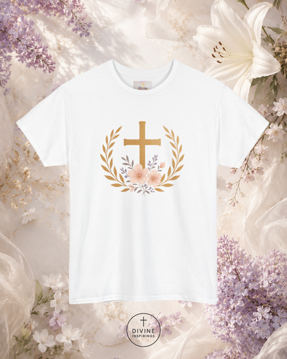 White t-shirt with a gold cross and floral design on a floral background