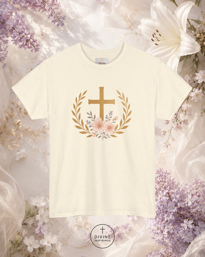 White t-shirt with a gold cross and floral design on a floral background