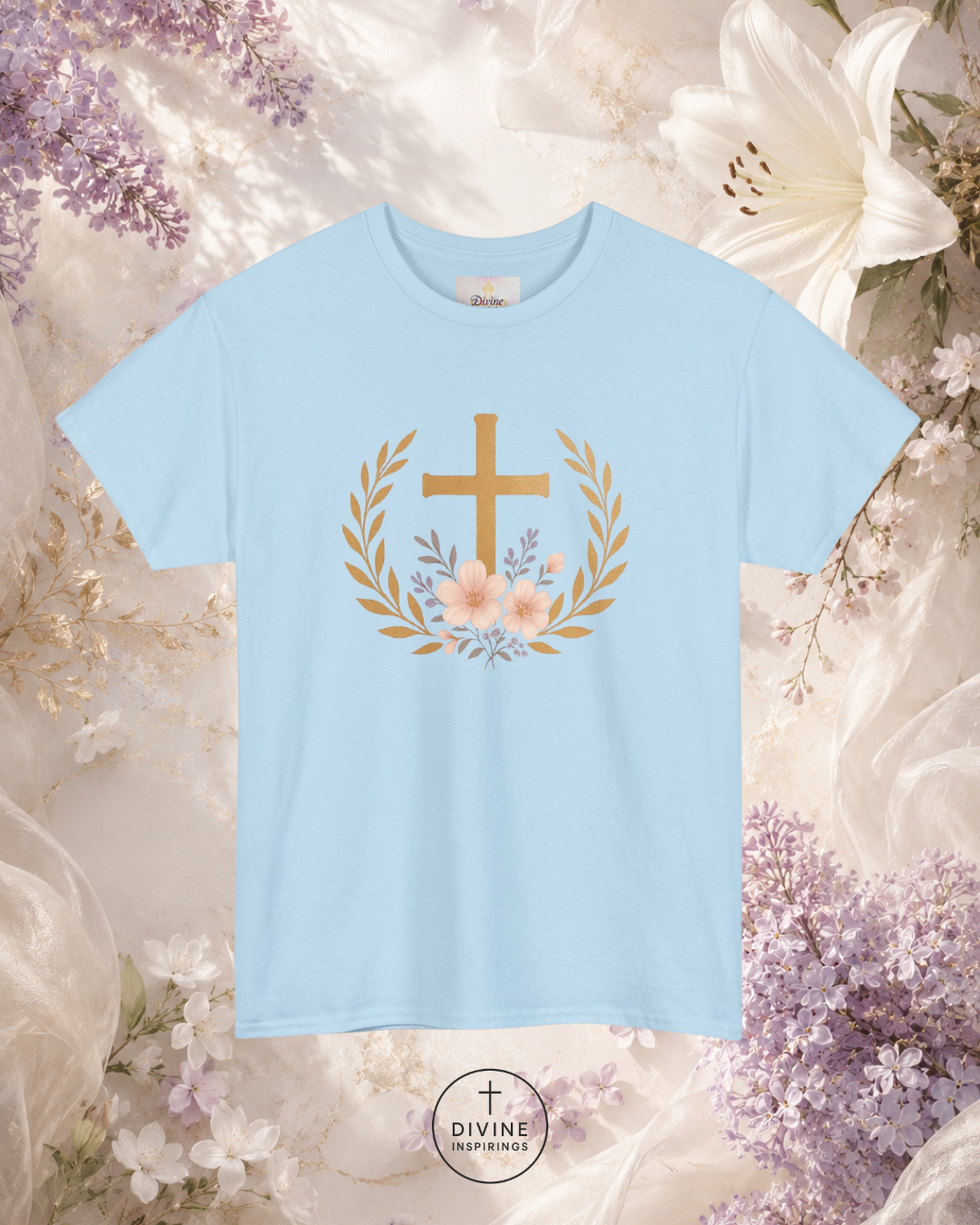 Light blue t-shirt with a gold cross and flowers design on a floral background