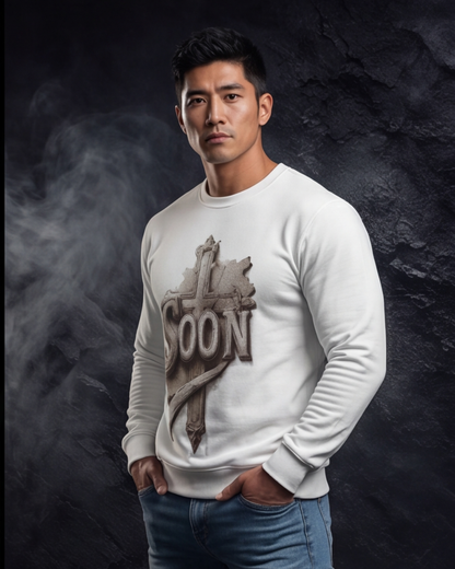 Man wearing a white sweatshirt with a graphic design on a dark background