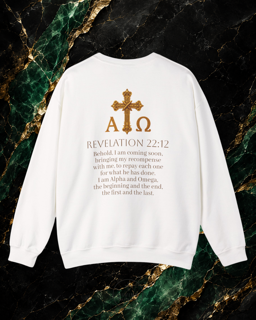 White sweatshirt with gold cross and text on a marble background
