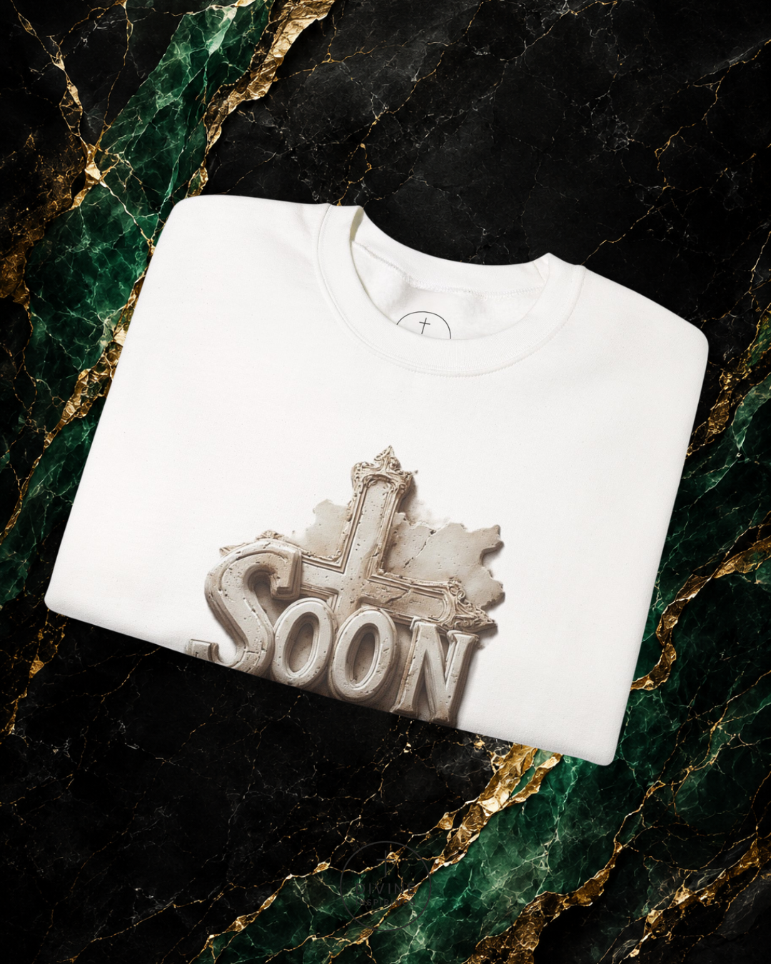 White sweatshirt with 'SOON' graphic on a marble surface