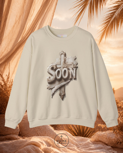 Beige sweatshirt with 'Soon' design against a warm, natural background