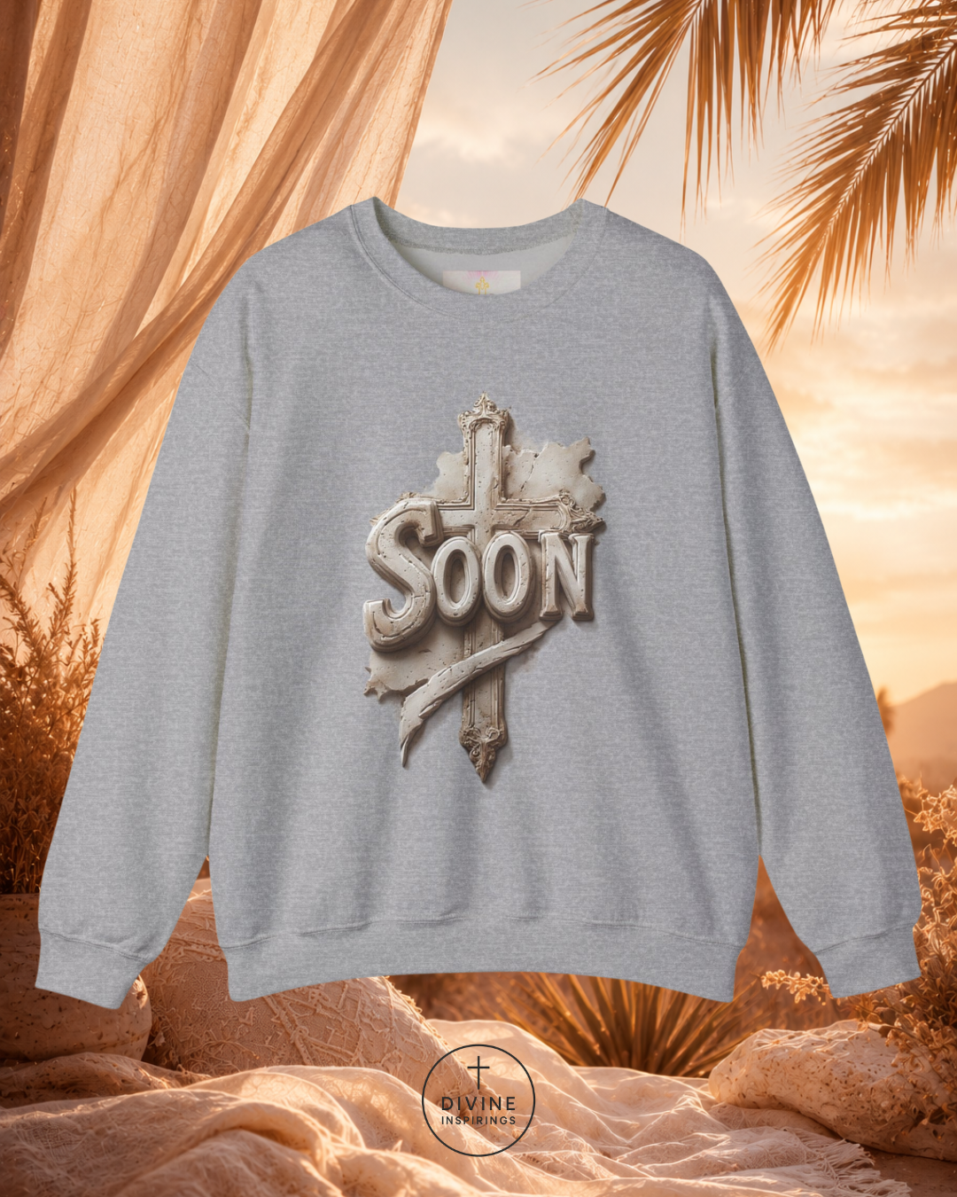 Gray sweatshirt with 'SOON' design against a desert sunset background