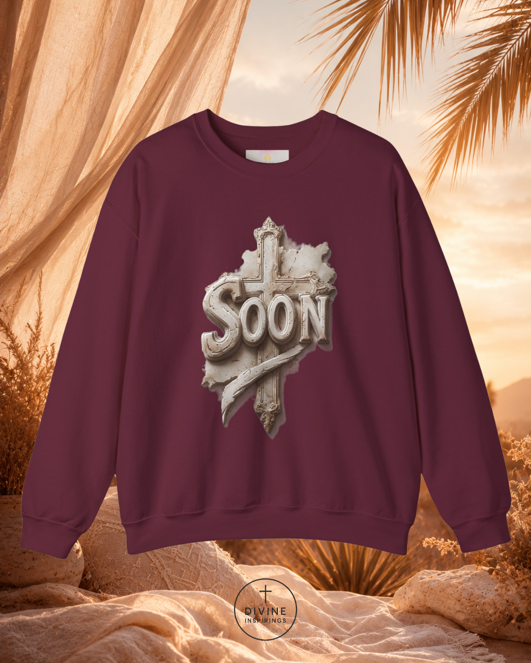 Maroon sweatshirt with 'SOON' graphic design against a desert sunset background
