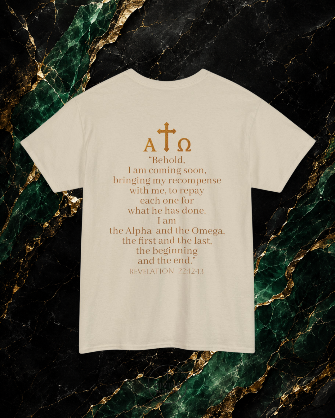 White t-shirt with gold text and symbols on a dark marble background