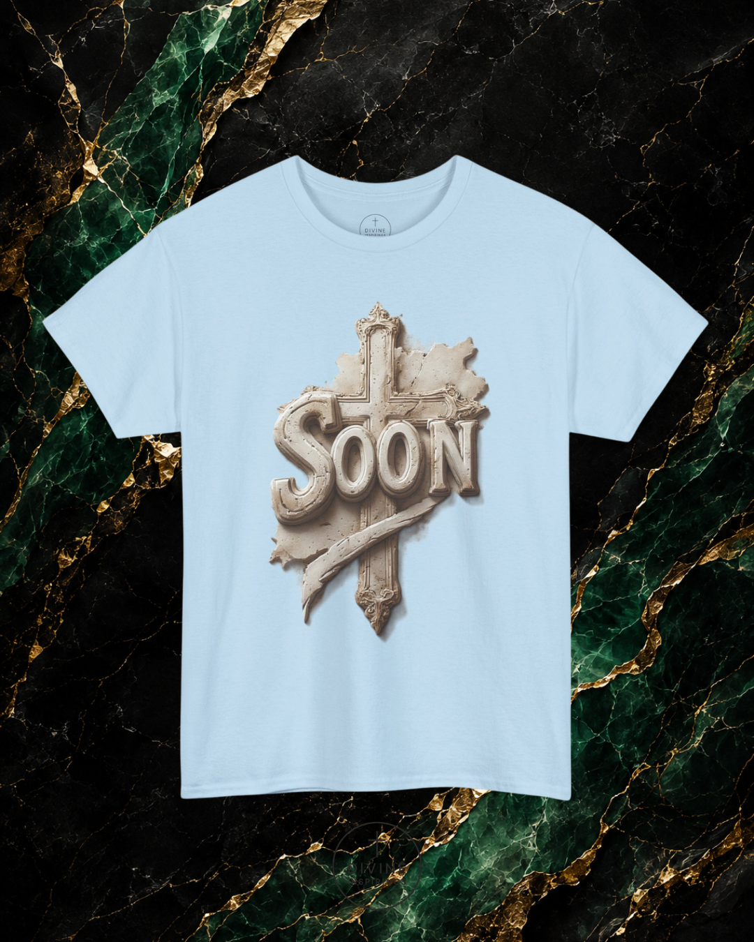 Light blue t-shirt with 'Soon' graphic design on a marble background
