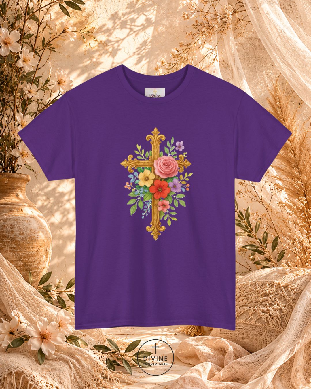 Purple t-shirt with floral cross design on a decorative background