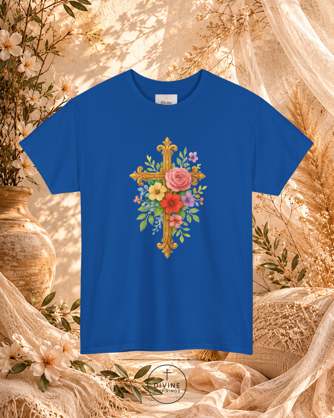 Blue t-shirt with floral cross design on a decorative background