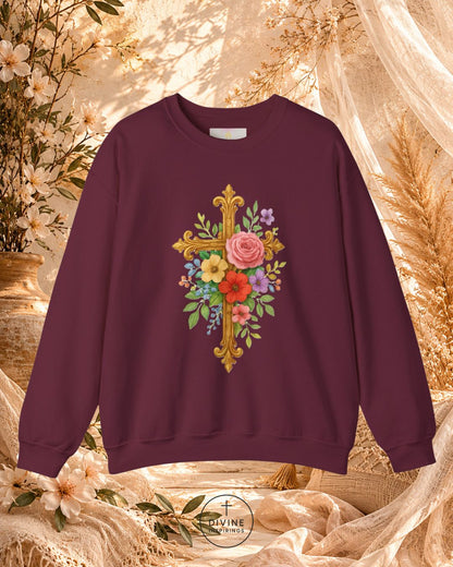 Maroon sweatshirt with floral cross design on a decorative background