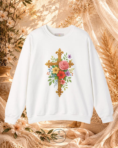 White sweatshirt with floral cross design on a decorative background