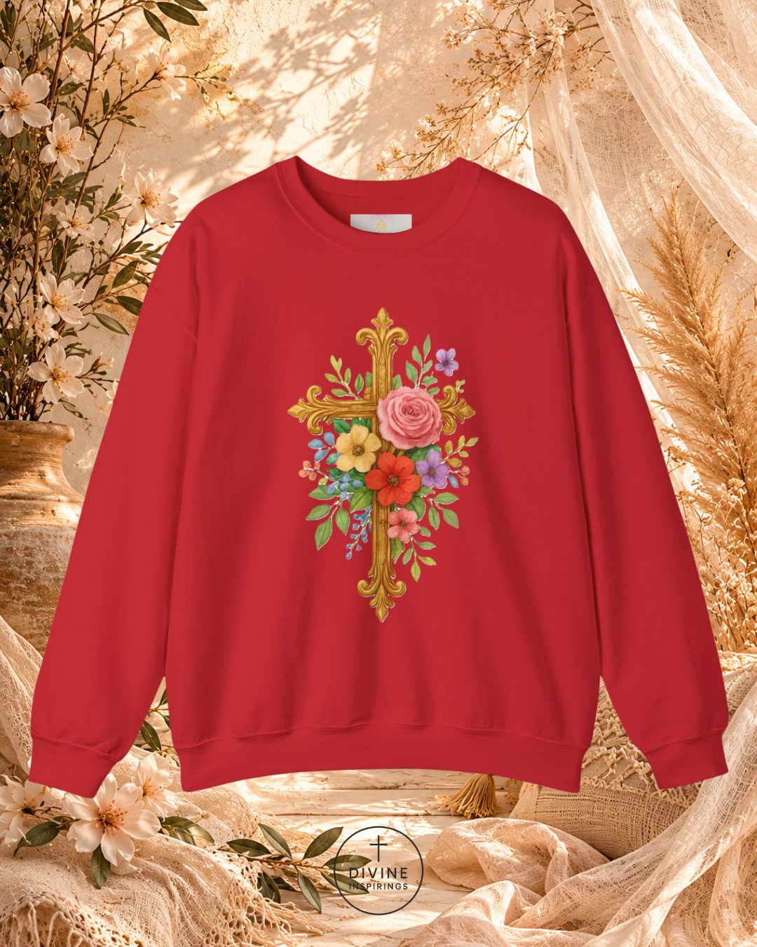 Red sweatshirt with floral and cross design on a decorative background