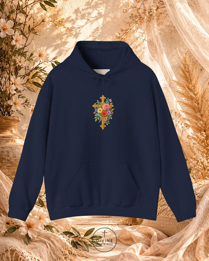 Navy blue hoodie with floral cross design on a decorative background