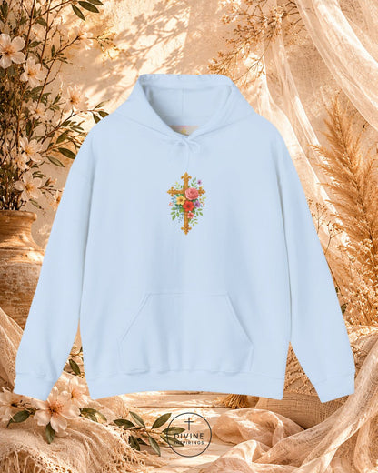 Light blue hoodie with floral design on a decorative background