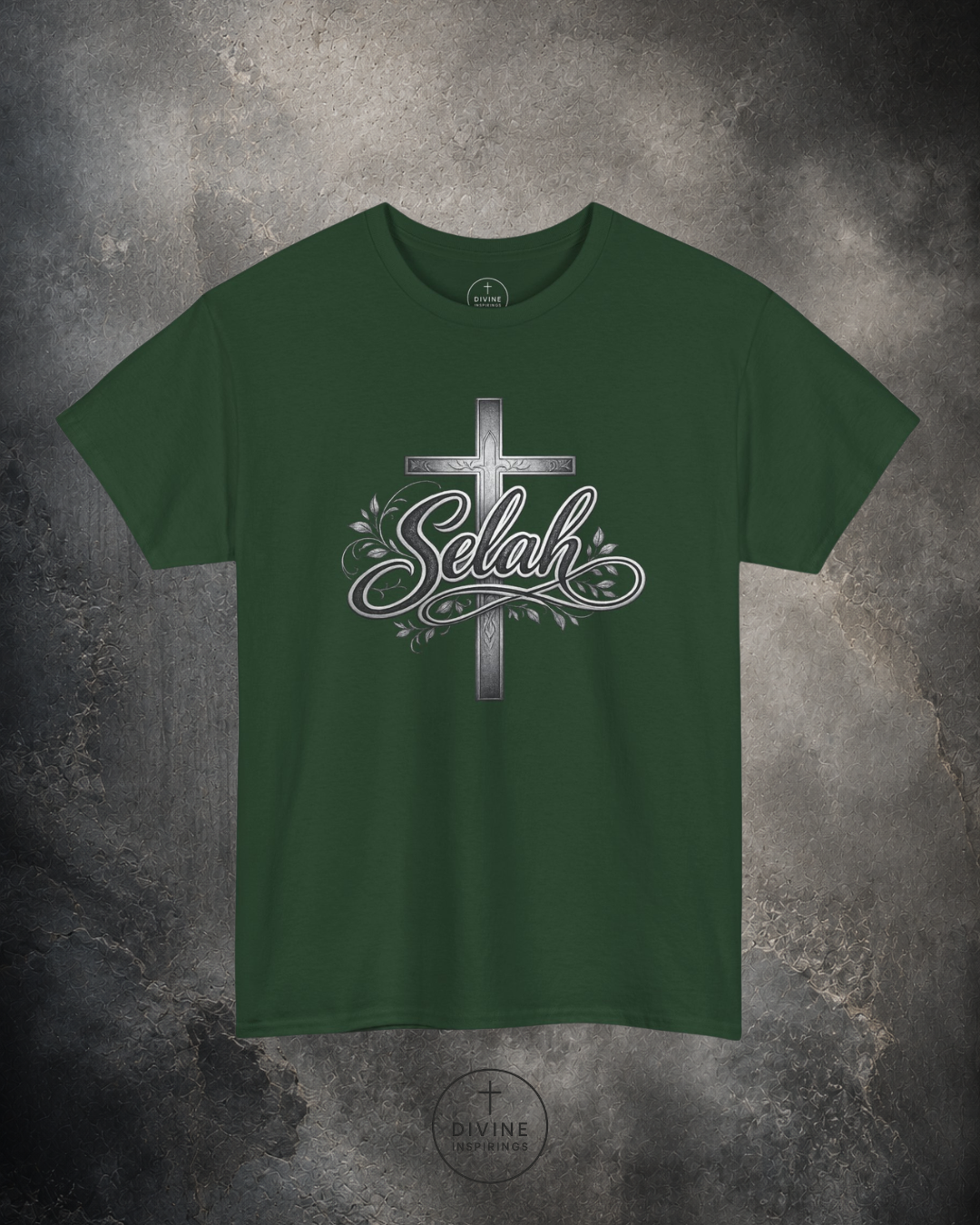 Green t-shirt with a cross and 'Selah' design on a textured gray background