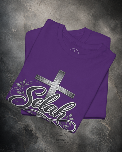 Purple t-shirt with a cross and 'Selah' design on a textured gray background