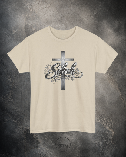 Beige t-shirt with a cross and 'Selah' design on a textured gray background
