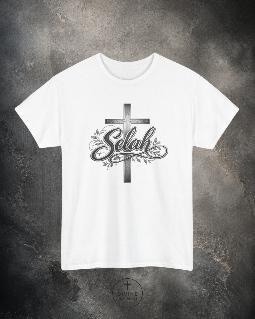 White t-shirt with a cross and 'Selah' design on a textured gray background