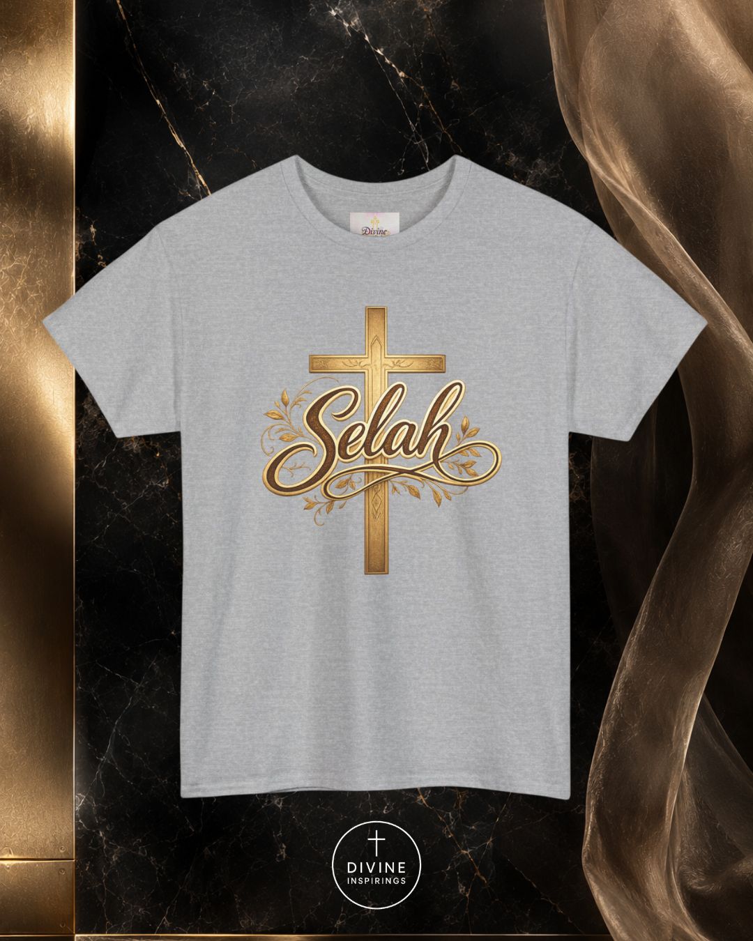 Gray t-shirt with gold cross and 'Selah' text on a dark marble background