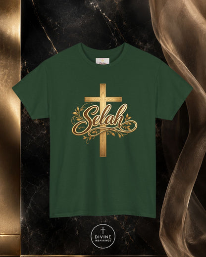 Green t-shirt with gold cross and 'Selah' design on a dark marble background