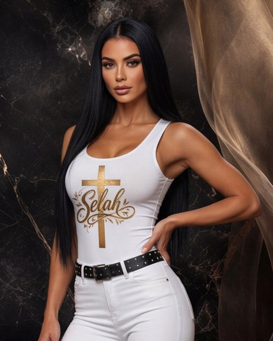 Woman wearing a white tank top with 'Selah' design against a dark background