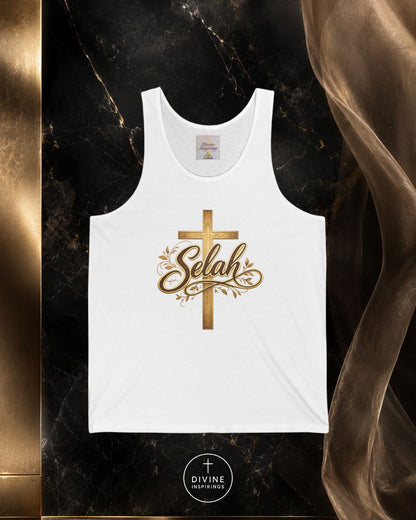 White tank top with gold cross and 'Selah' text on a dark marble background