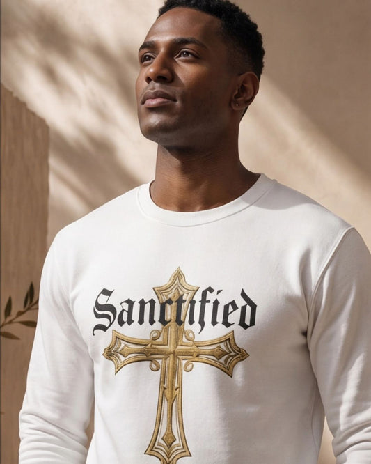 Man wearing a white long-sleeve shirt with 'Sanctified' and a cross design.