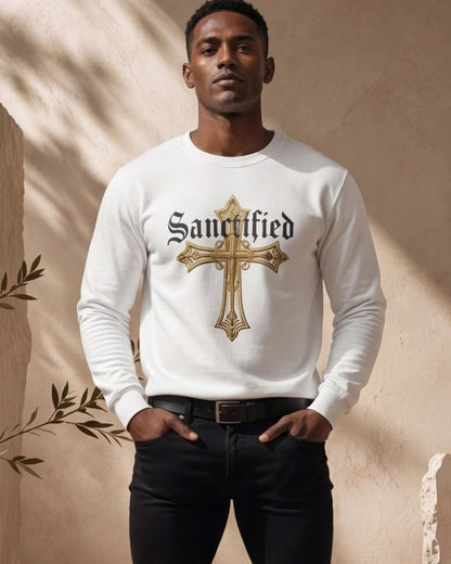 Man wearing a white sweatshirt with 'Sanctified' and a cross design against a beige background