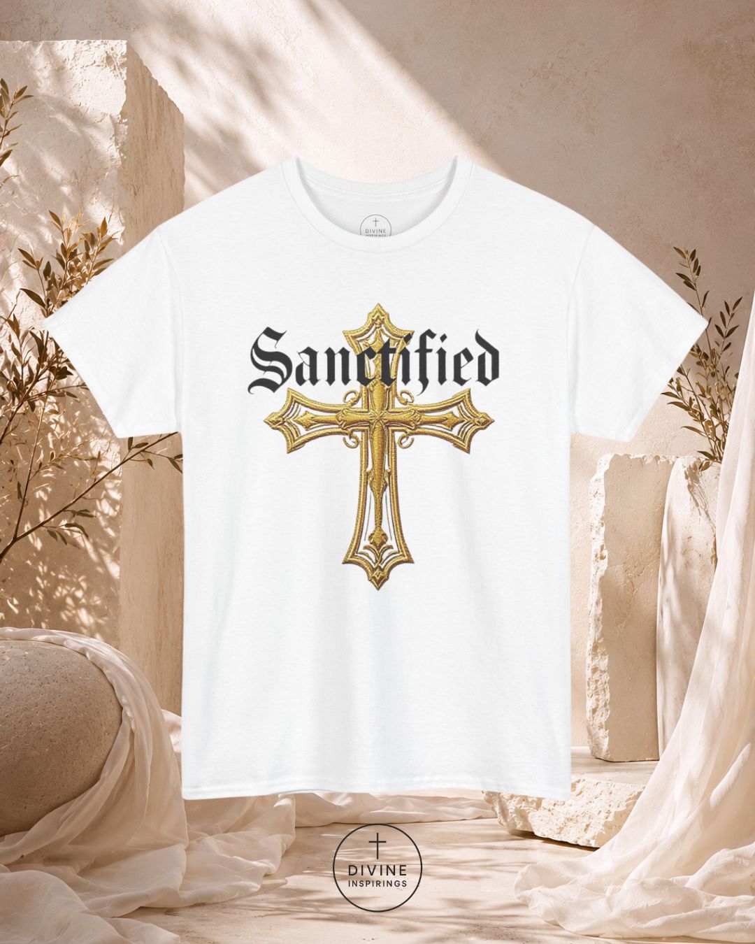 White t-shirt with a gold cross and 'Sanctified' text on a neutral background