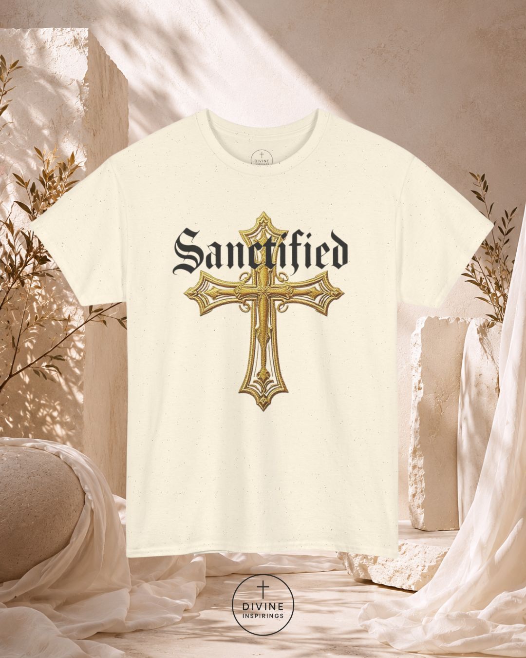 White t-shirt with gold cross and 'Sanctified' text on a decorative background