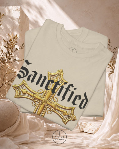White sweatshirt with gold cross and 'Sanctified' text on a light background