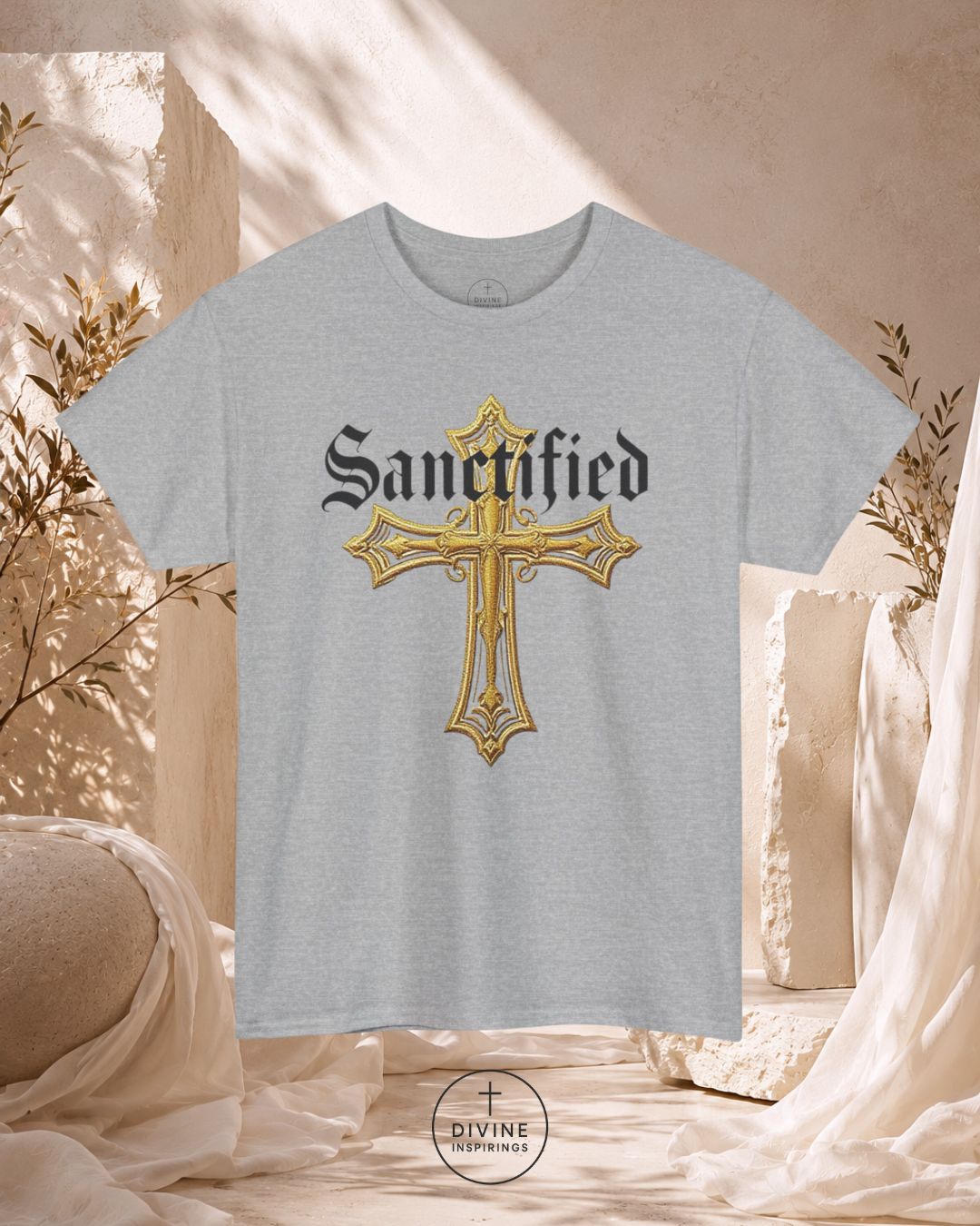 Gray t-shirt with a gold cross and 'Sanctified' text on a neutral background
