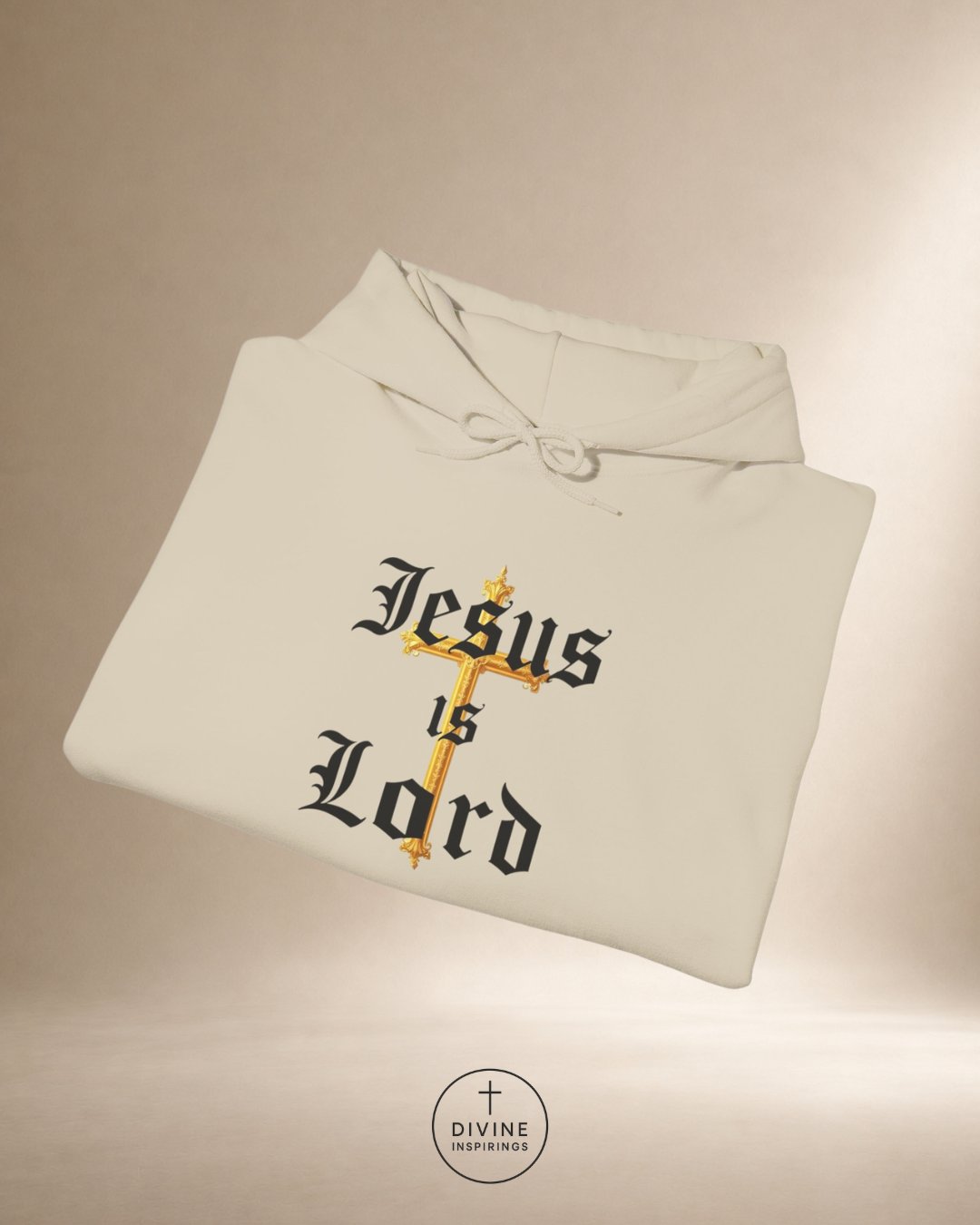 Folded hoodie with 'Jesus is Lord' text on a beige background