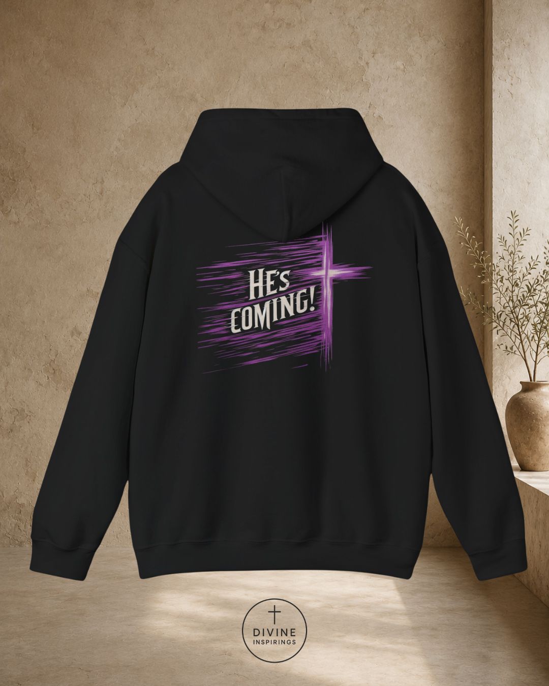 Black hoodie with 'He's Coming!' text on the back, displayed against a neutral background.
