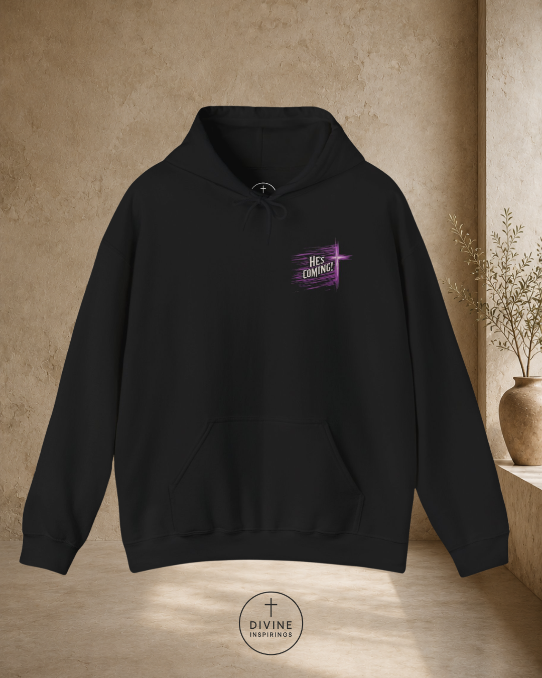 Black hoodie with a purple graphic on a beige background